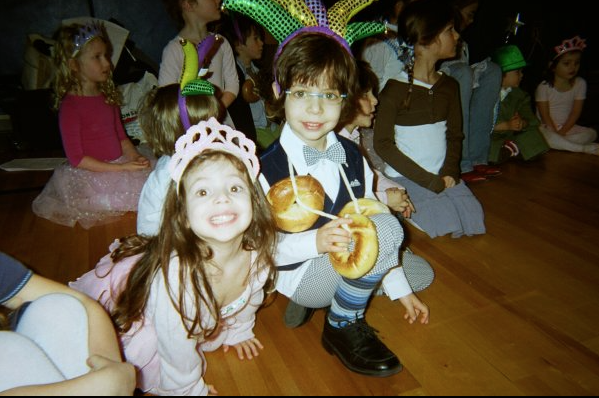 Two children playing together at a room