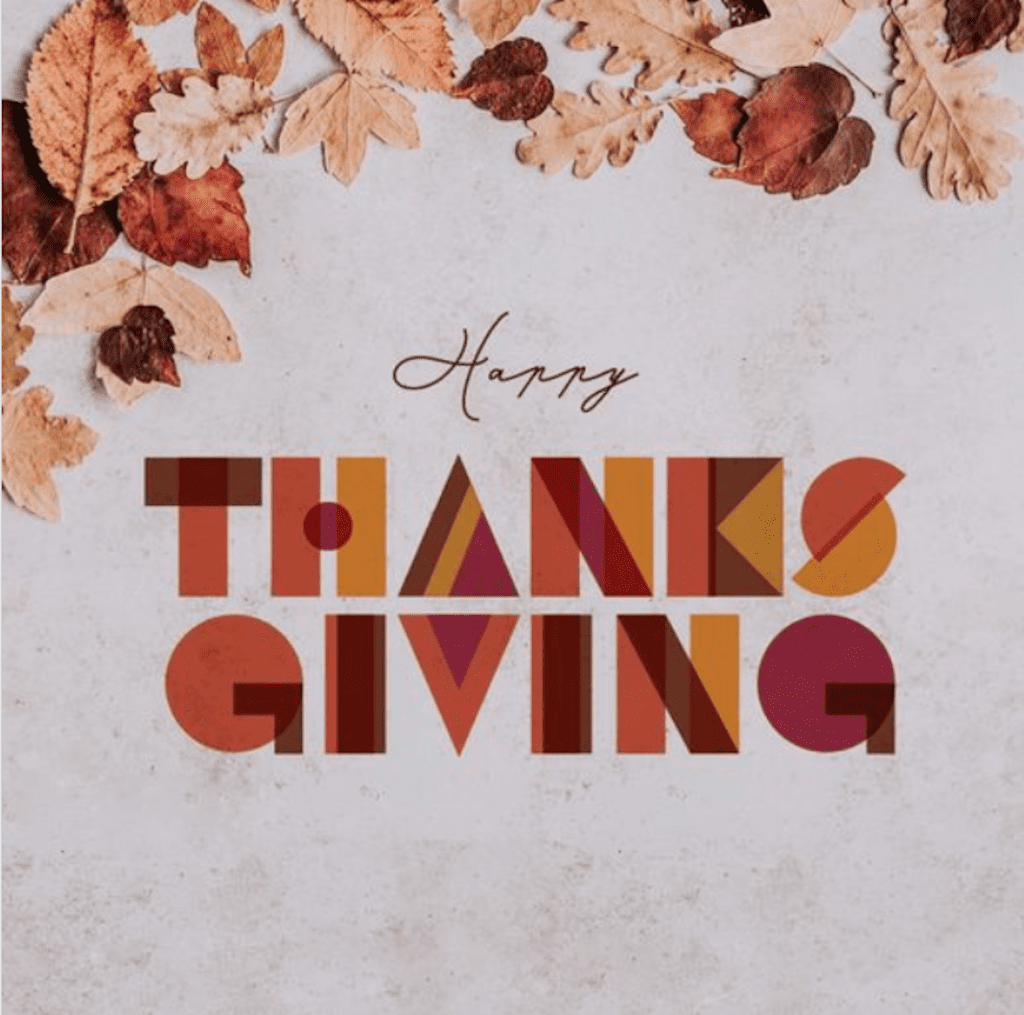 A Happy Thanksgiving poster with leaves on top