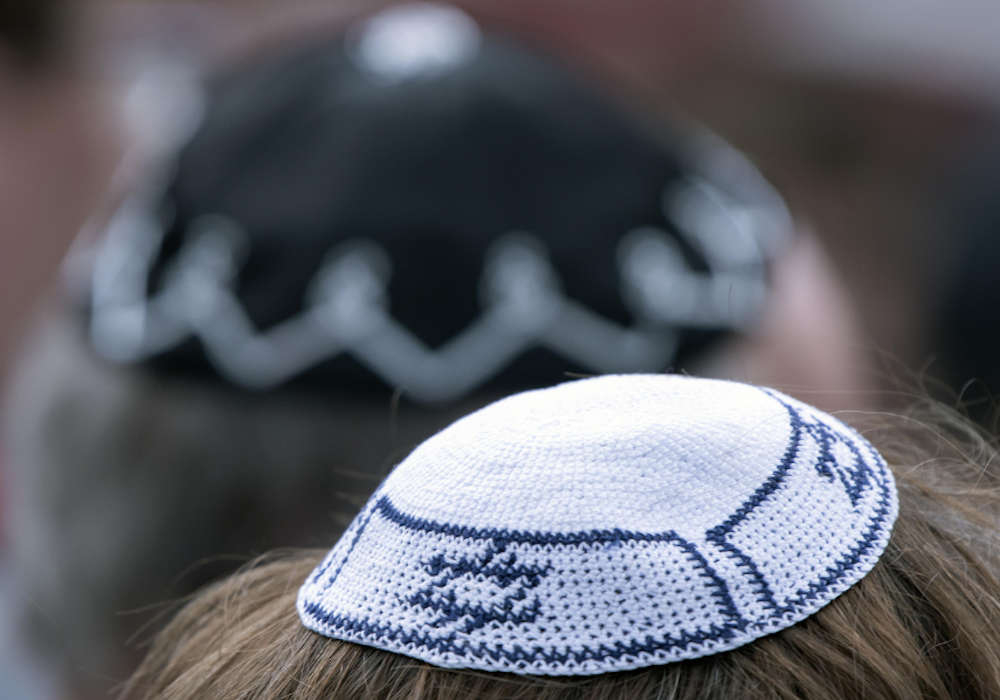 A white color cap kept at a head