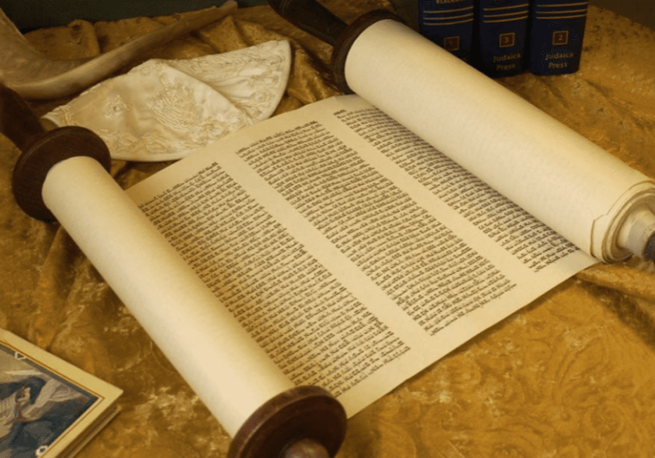 A scroll of a book on a table.